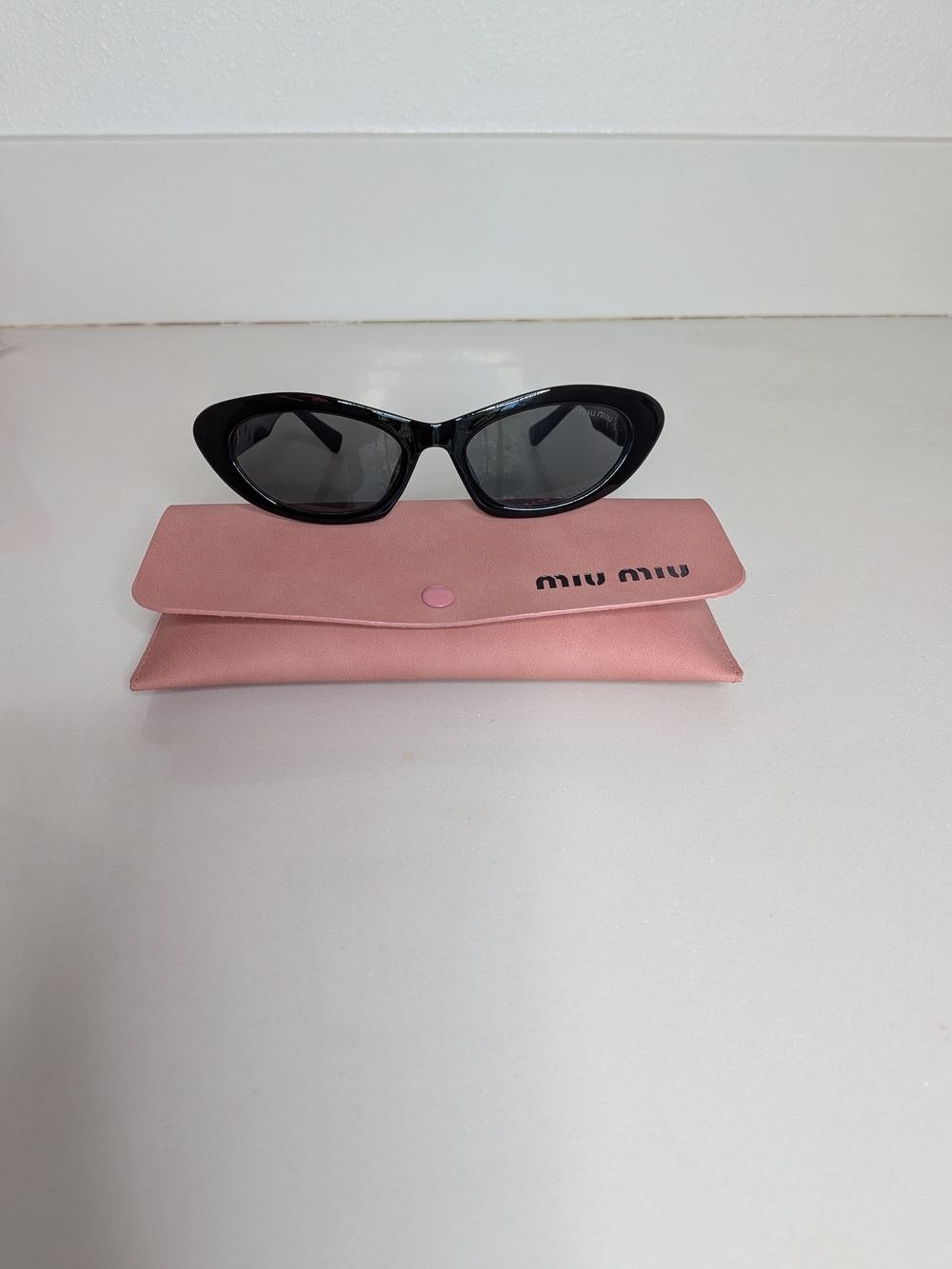 Miu Miu Women's Black Oval Cat Eye Sunglasses - Picture 2 of 13